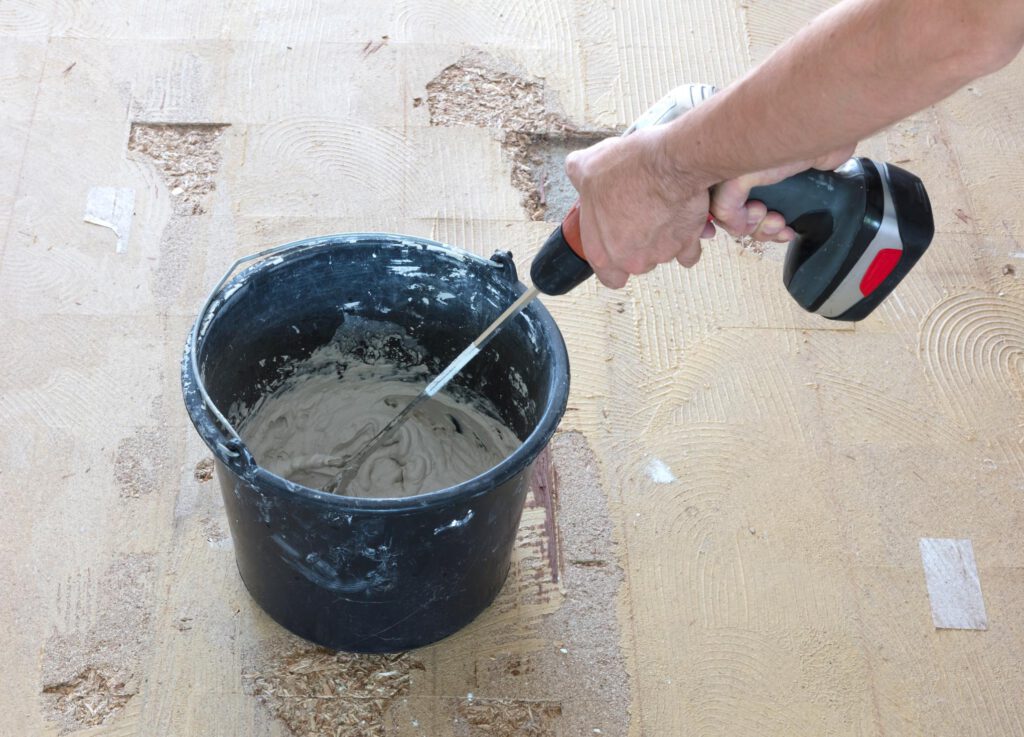 worker mixing the epoxy