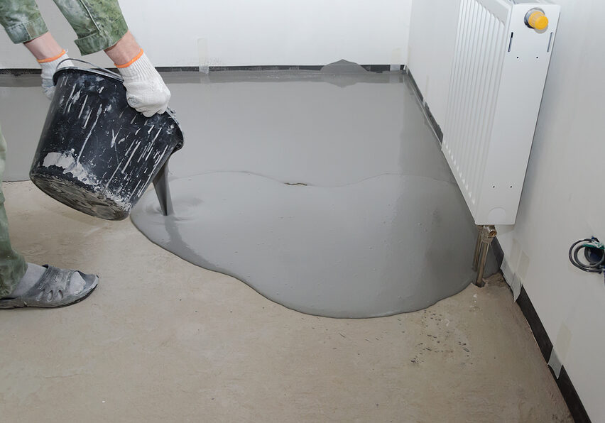 worker pouring the epoxy